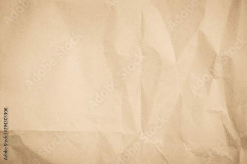 Brown recycled craft paper texture as background. Cream paper texture, Old vintage page or grunge vignette. Pattern rough art creased grunge letter. Hardboard with copy space for text.