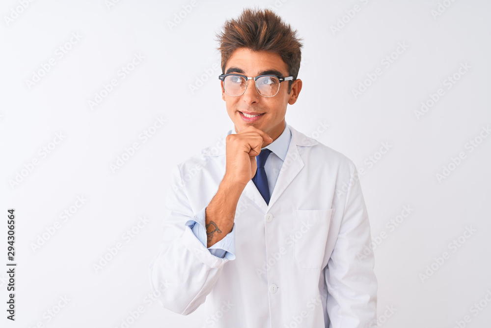 Young handsome sciencist man wearing glasses and coat over isolated white background with hand on chin thinking about question, pensive expression. Smiling and thoughtful face. Doubt concept.