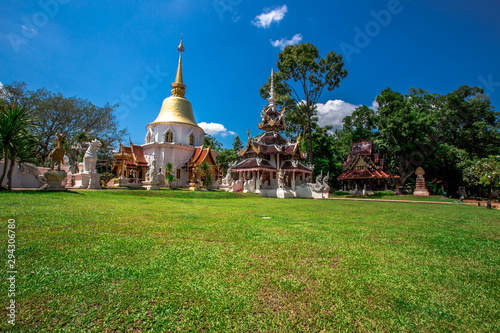 background,Open view of the temple at Dara Pirom Temple (Mae Rim),which has a large statue in front of the temple. Covered by trees and sky, Chiang Mai Province, Thailand, Wat Pa Daphirom