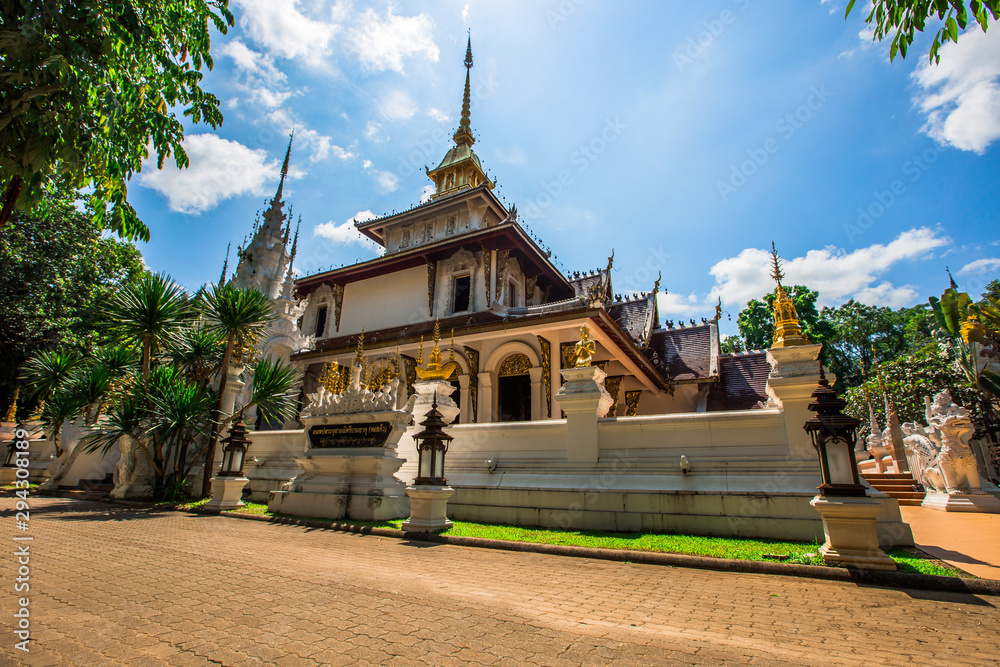 Naklejka premium background,Open view of the temple at Dara Pirom Temple (Mae Rim),which has a large statue in front of the temple. Covered by trees and sky, Chiang Mai Province, Thailand, Wat Pa Daphirom