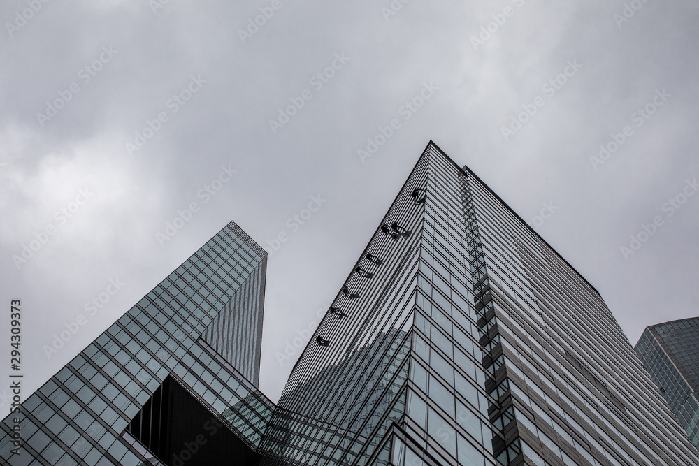 group of workers cleaning windows service on high rise building