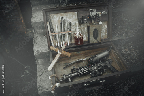 Fotografia A set of things hunter evil spirits, demons, vampires in an old suitcase