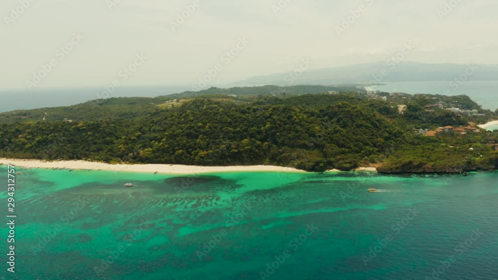 Aerial seascape: Tropical beach with palm trees and turquoise waters of the coral reef, from above, Puka shell beach. Boracay, Philippines. Seascape with beach on tropical island. Summer and travel Aerial seascape: Tropical beach with palm trees and turquoise waters of the coral reef, from above, Puka shell beach. Boracay, Philippines. Seascape with beach on tropical island. Summer and travel