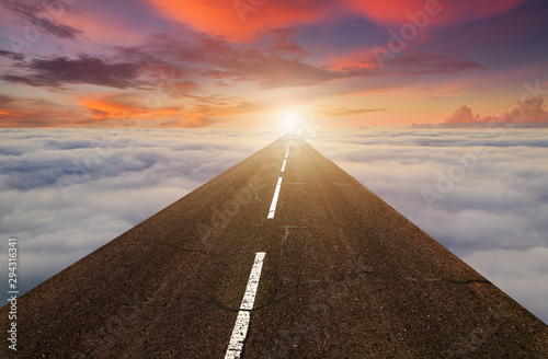Fényképezés The road in the clouds at sunset. Concept