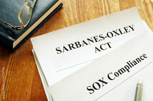 Sarbanes-Oxley Act and SOX compliance policy on table. photo