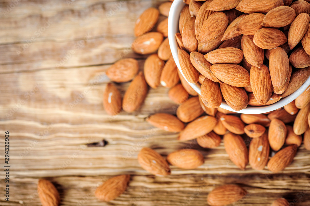custom made wallpaper toronto digitalTop view of almonds on wooden table. Almonds nuts concept.
