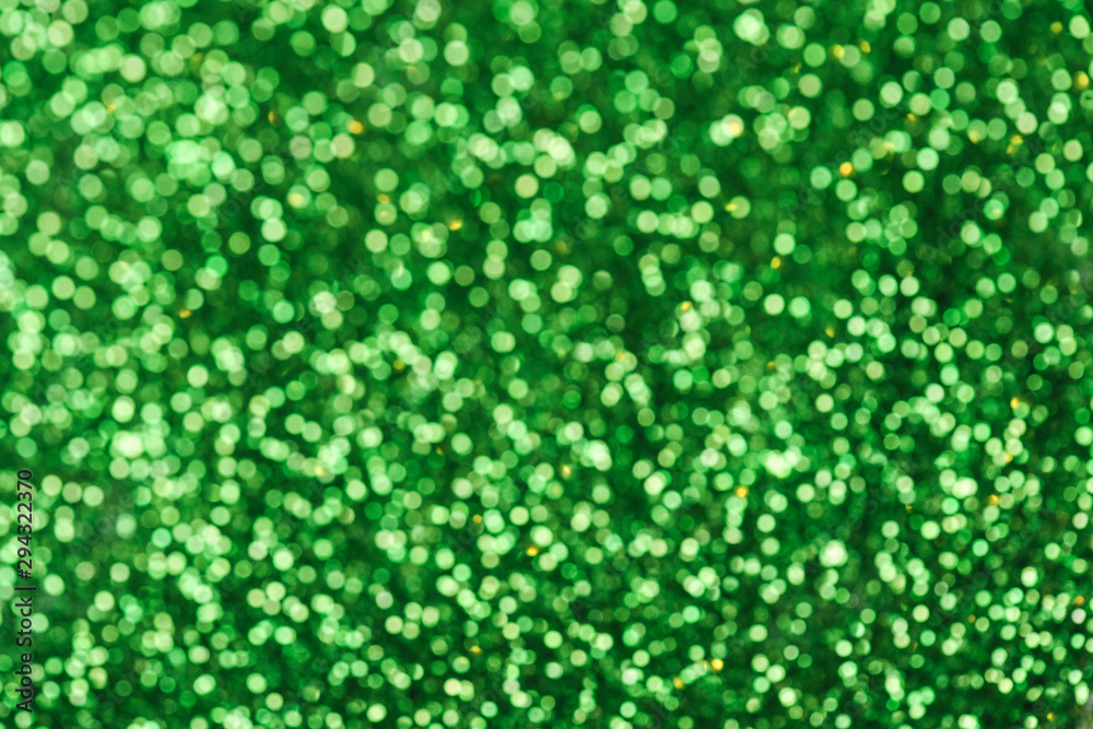 Green glitters. Green shiny abstract texture. Green glitters. Green shiny abstract texture.