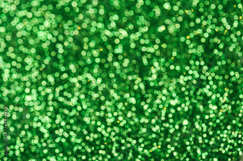 Green glitters. Green shiny abstract texture.
