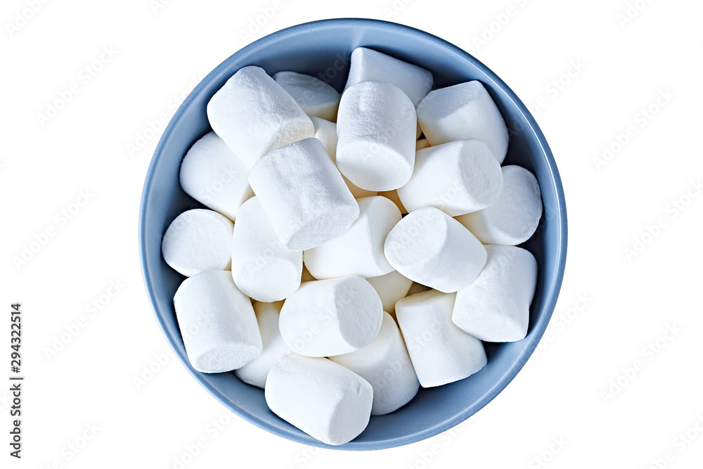 Single blue circle ceramic bowl full of many pieces of raw sweet tasty marshmallows cylindrical form isolated on white background. Top view Single blue circle ceramic bowl full of many pieces of raw sweet tasty marshmallows cylindrical form isolated on white background. Top view