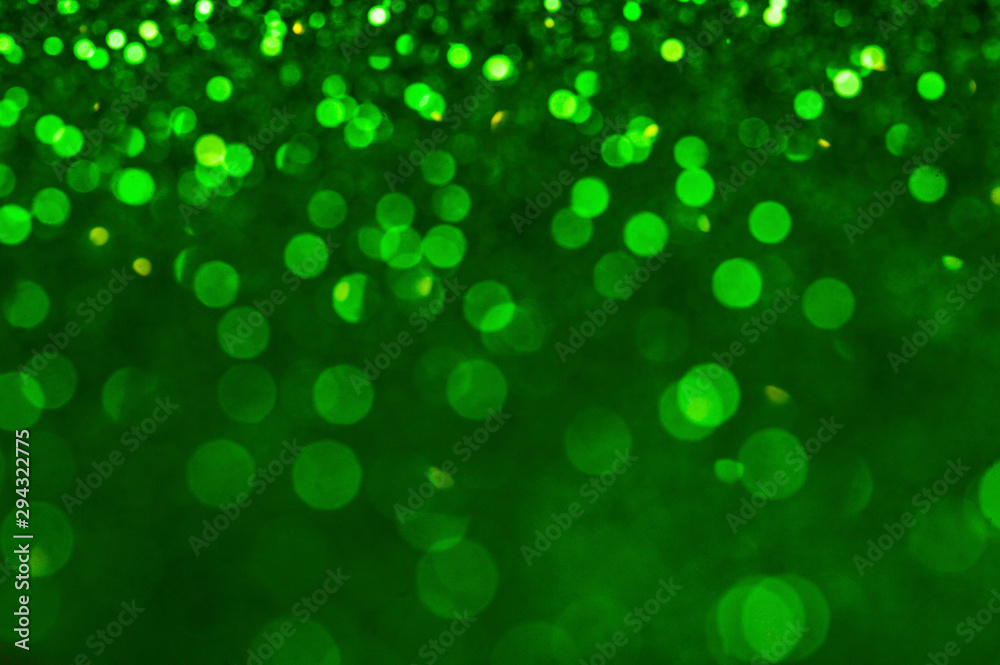 Green shiny glitters background. Green abstract texture. Green shiny glitters background. Green abstract texture.