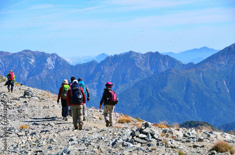 Trekkers walking along the ridgeline of mt.Tateyama, Toyama, Japan