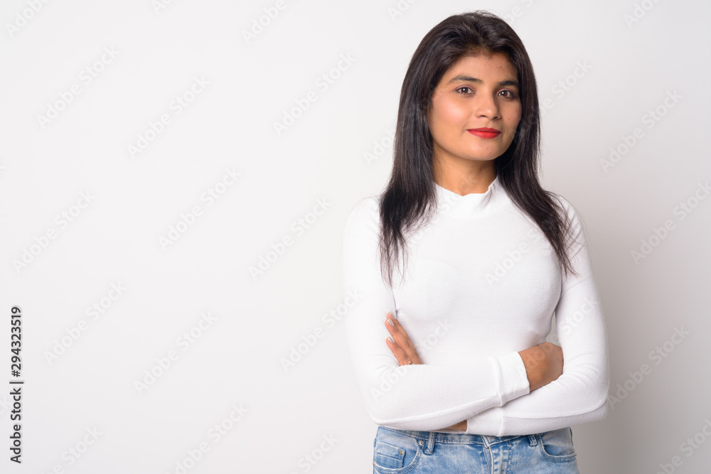 Portrait of young beautiful Persian woman with arms crossed Portrait of young beautiful Persian woman with arms crossed