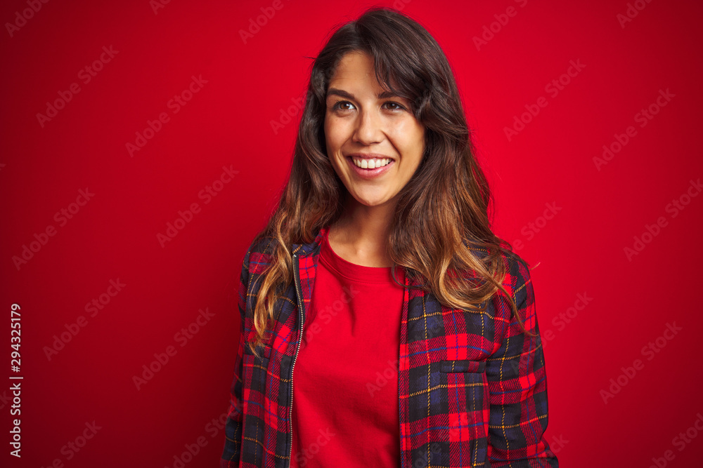 Young beautiful woman wearing casual jacket standing over red isolated background confuse and wondering about question. Uncertain with doubt, thinking with hand on head. Pensive concept. Young beautiful woman wearing casual jacket standing over red isolated background confuse and wondering about question. Uncertain with doubt, thinking with hand on head. Pensive concept.