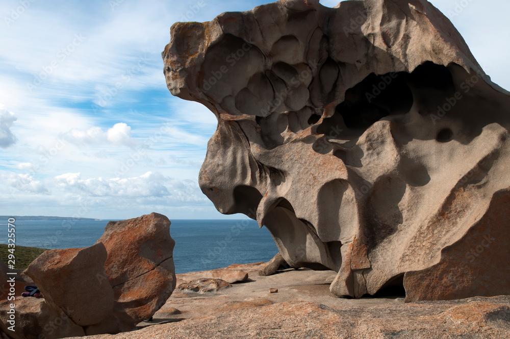 Kangaroo Island Australia, weather sculpted granite boulder at Remarkable Rocks with horizon over Southern Ocean in background