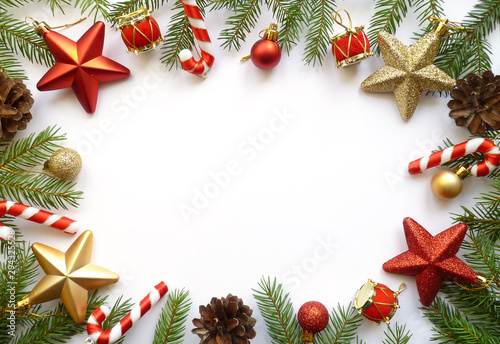 Christmas holidays composition on white background. X-mas decorations, pine cones and fir branches. Flat lay, top view, copy space