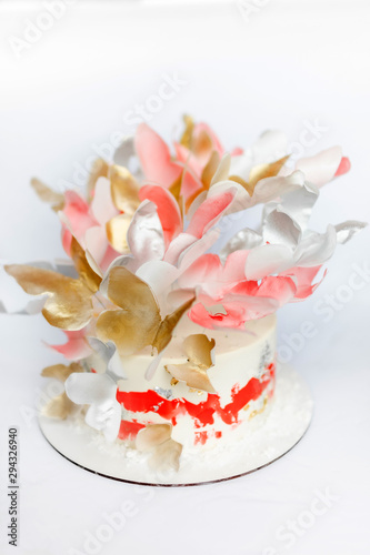 A wedding cake. Festive white cake with butterflies.