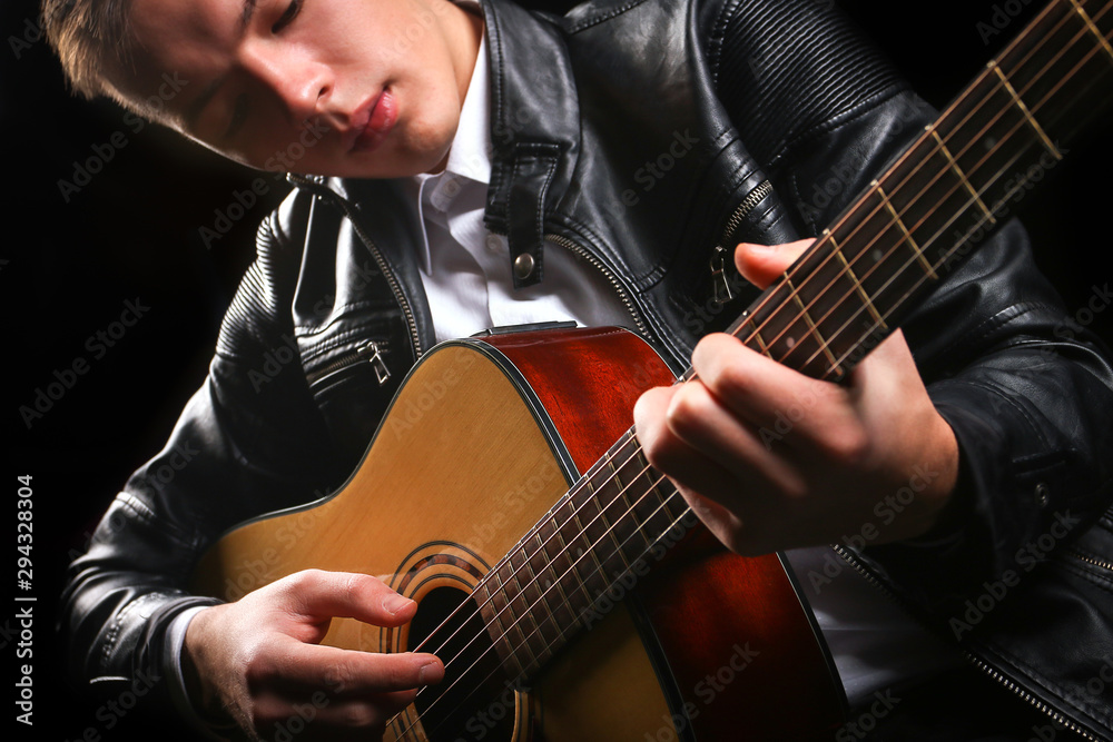 Fototapeta premium Young men playing the guitar