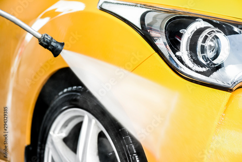 Fotografie Car washing at car wash station
