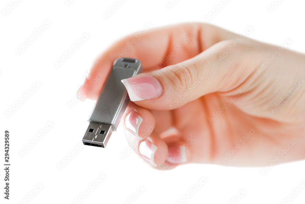Woman hand holding silver usb in finger with beatiful nails. Flash drive holding in hand isolated. Woman hand holding silver usb in finger with beatiful nails. Flash drive holding in hand isolated.