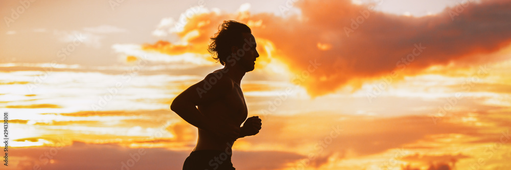 Runner fit athlete man jogging on sunset outdoor silhouette panorama banner background. Active sport lifestyle.