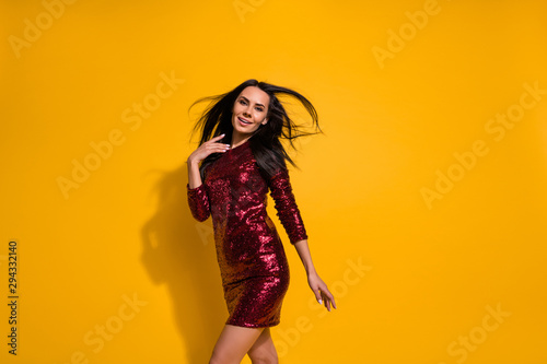 Profile photo of amazing lady with perfect slim shapes hairdo flight going on corporate party wear short shine red dress isolated yellow color background