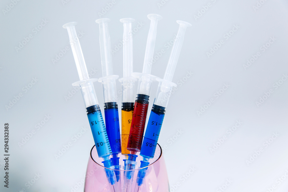 A set of medical syringes with color injections for cosmetology. The cocktail of the beautician for skin rejuvenation. A set of medical syringes with color injections for cosmetology. The cocktail of the beautician for skin rejuvenation.