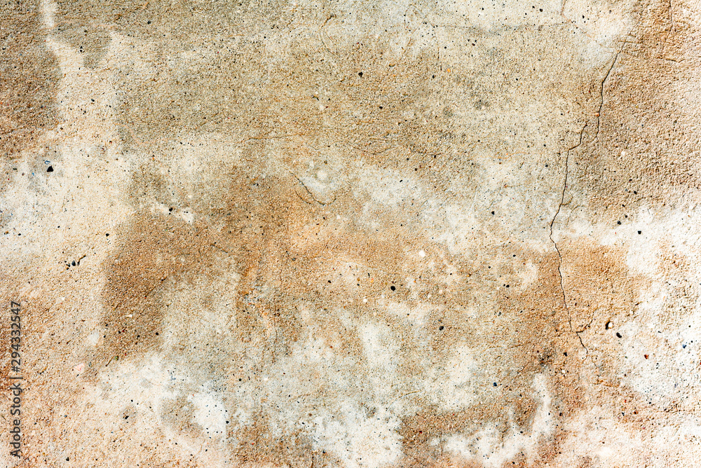 Texture of a concrete wall with cracks and scratches which can be used as a background Texture of a concrete wall with cracks and scratches which can be used as a background