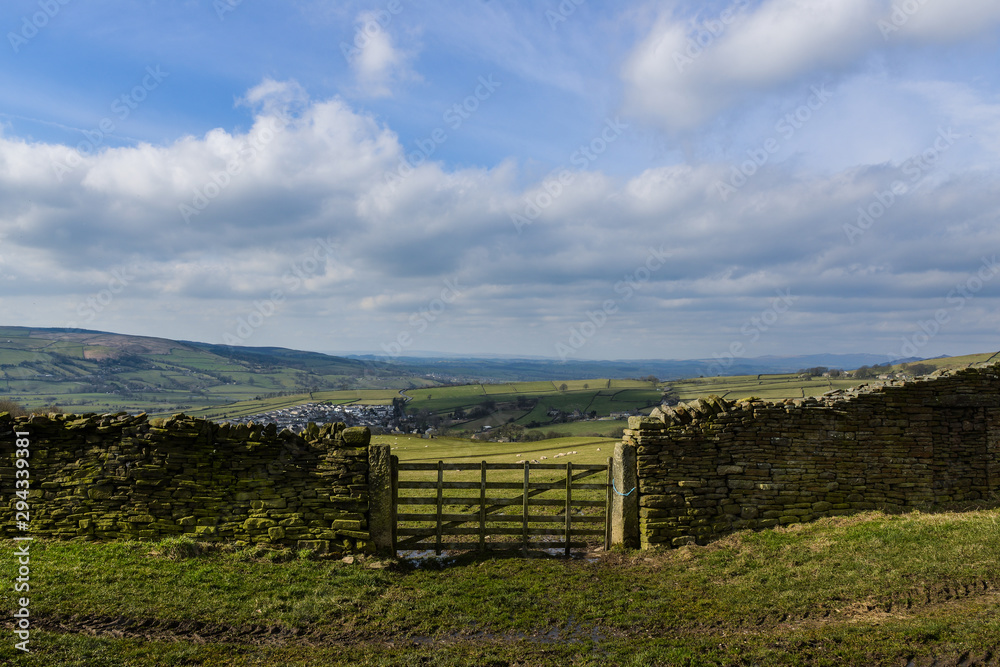 Overlooking farmland to livestock and village to Yorkshire countryside