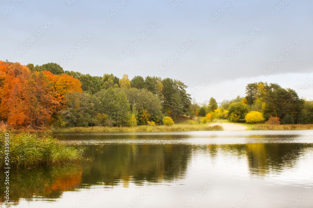 Very nice scenery. Autumn, lake and forest in natural colors during the fall