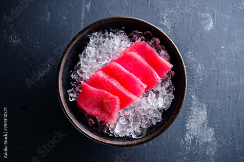 Japanese foods sashimi, Fresh raw sliced fish on black plate, Traditional Japanese food menu