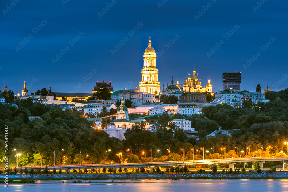 Scenic landscape view of Kyiv Pechersk Lavra at twilight from left Dneper bank in Kyiv, Ukraine