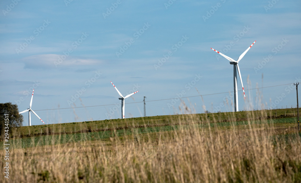 wind turbines farm, power generating windmills, Wind turbines on green hills wind turbines farm, power generating windmills, Wind turbines on green hills