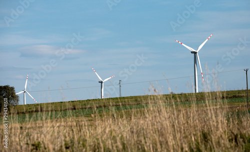 wind turbines farm, power generating windmills, Wind turbines on green hills