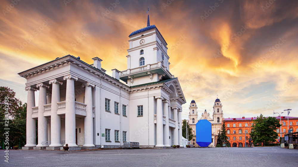 Minsk, Belarus. Old Minsk City Hall on Freedom Square Hall with rainbow - Famous Landmark