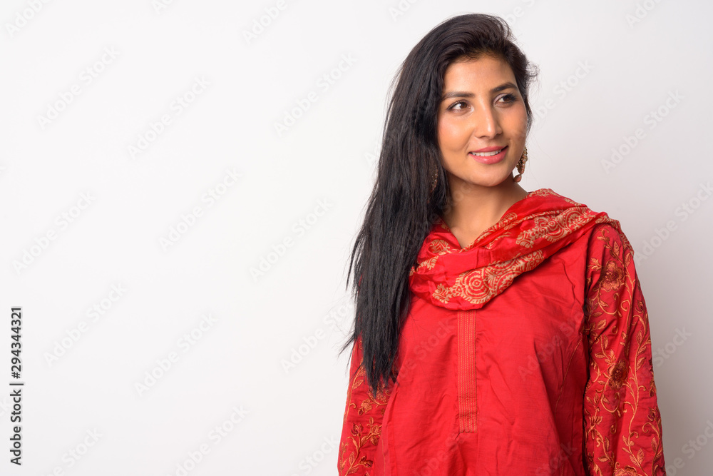 Naklejka premium Face of happy young Persian woman thinking in traditional clothing