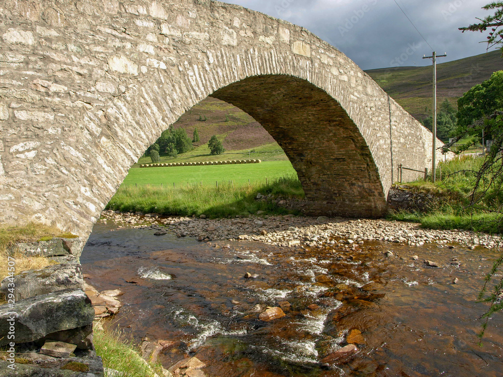 landscape with a beautiful arched stone bridge