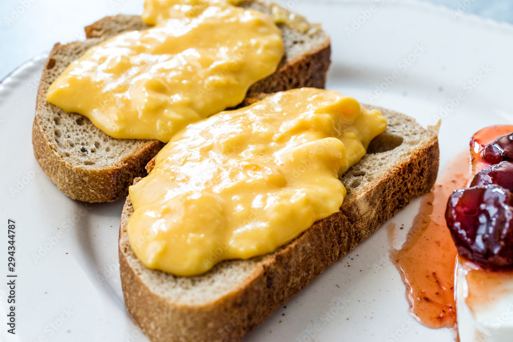 Scrambled Eggs with Bread Slice, Cheese and Jam / Marmalade. Scrambled Eggs with Bread Slice, Cheese and Jam / Marmalade.