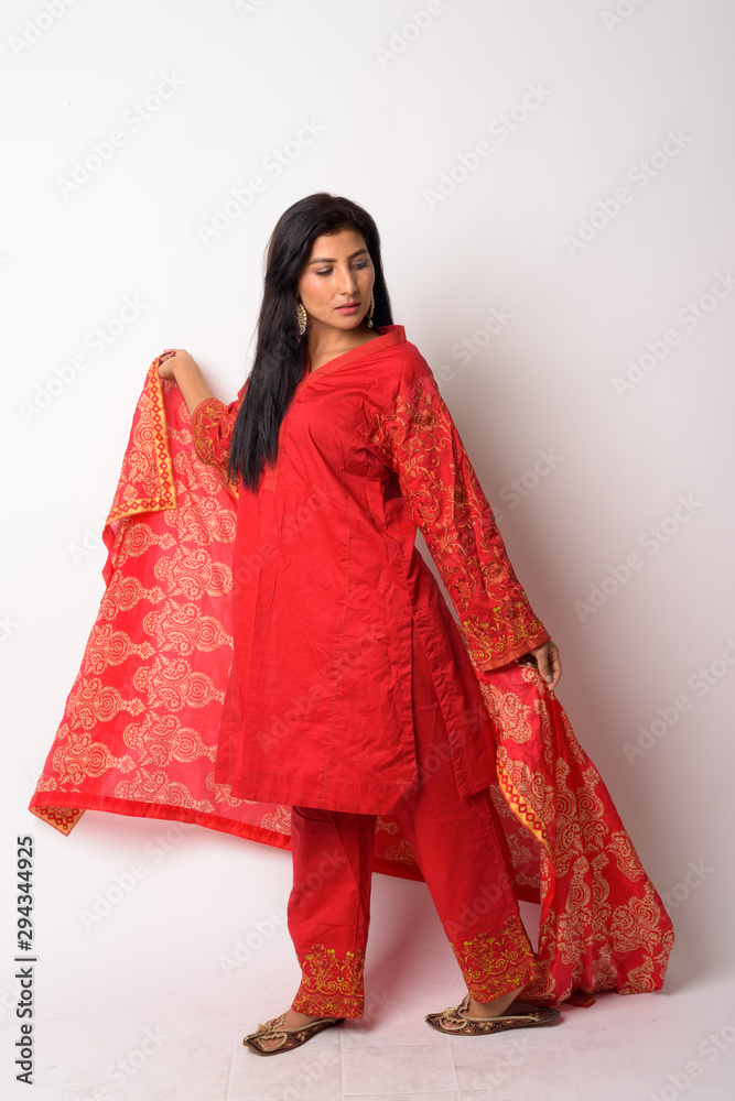 Full body shot of young Persian woman in traditional clothing Full body shot of young Persian woman in traditional clothing