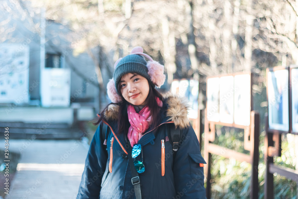Beautiful young Asian woman in her winter jacket, traveler concept. Beautiful young Asian woman in her winter jacket, traveler concept.