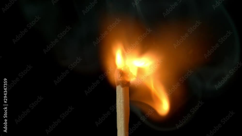Super Slow Motion Macro Shot of Igniting Match against Black Background at 1000fps. Shooted with High Speed Cinema Camera in 4K Resolution. Super Slow Motion Macro Shot of Igniting Match against Black Background at 1000fps. Shooted with High Speed Cinema Camera in 4K Resolution.