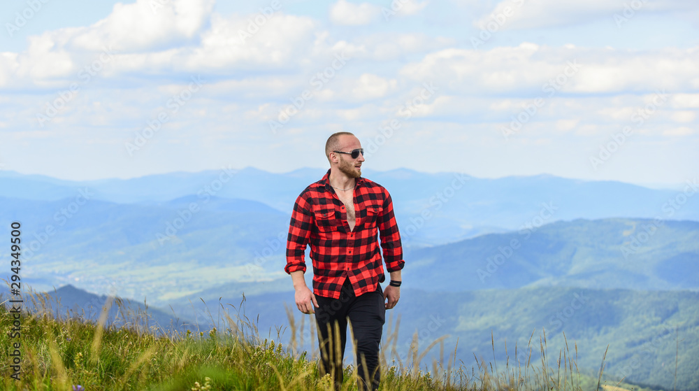 Masculine power. Tourist walking mountain hill. Power of nature. Man stand on top of mountain landscape background. Hiking concept. Discover world. Masculinity and male energy. Natural power