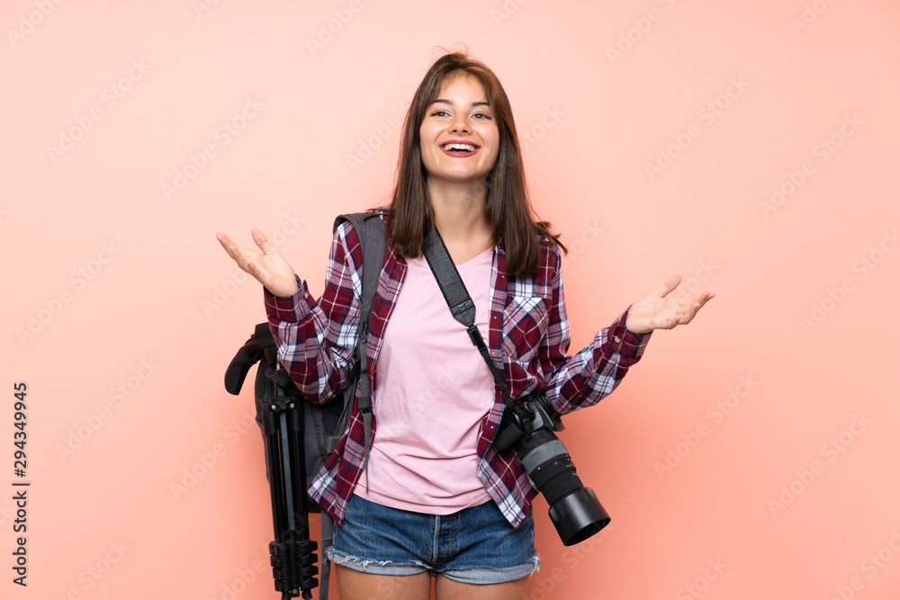 Young photographer girl over isolated pink background unhappy and frustrated with something Young photographer girl over isolated pink background unhappy and frustrated with something