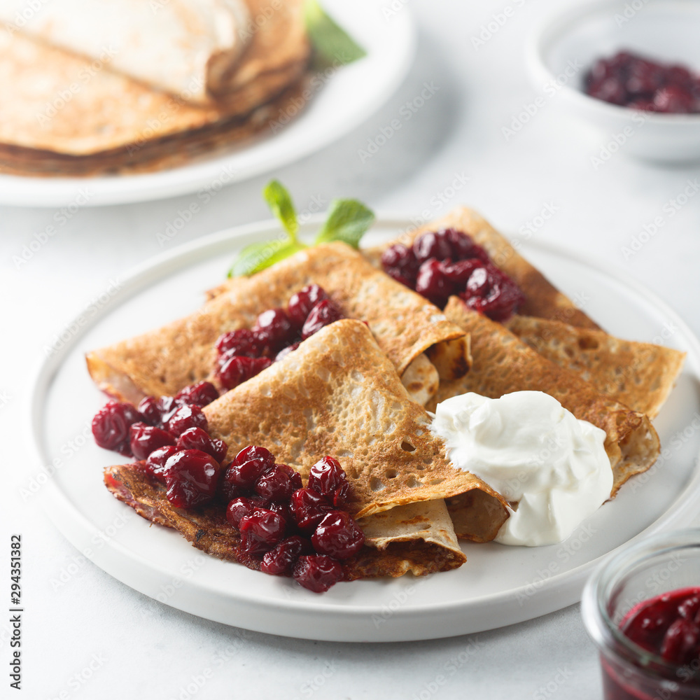Homemade crepes with cherry sauce Homemade crepes with cherry sauce