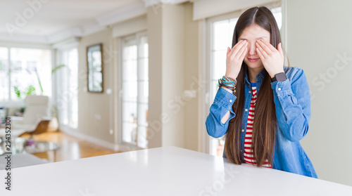 Young beautiful asian woman with long hair wearing denim jacket rubbing eyes for fatigue and headache, sleepy and tired expression. Vision problem