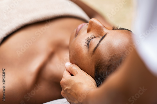 Black woman getting head massage photo