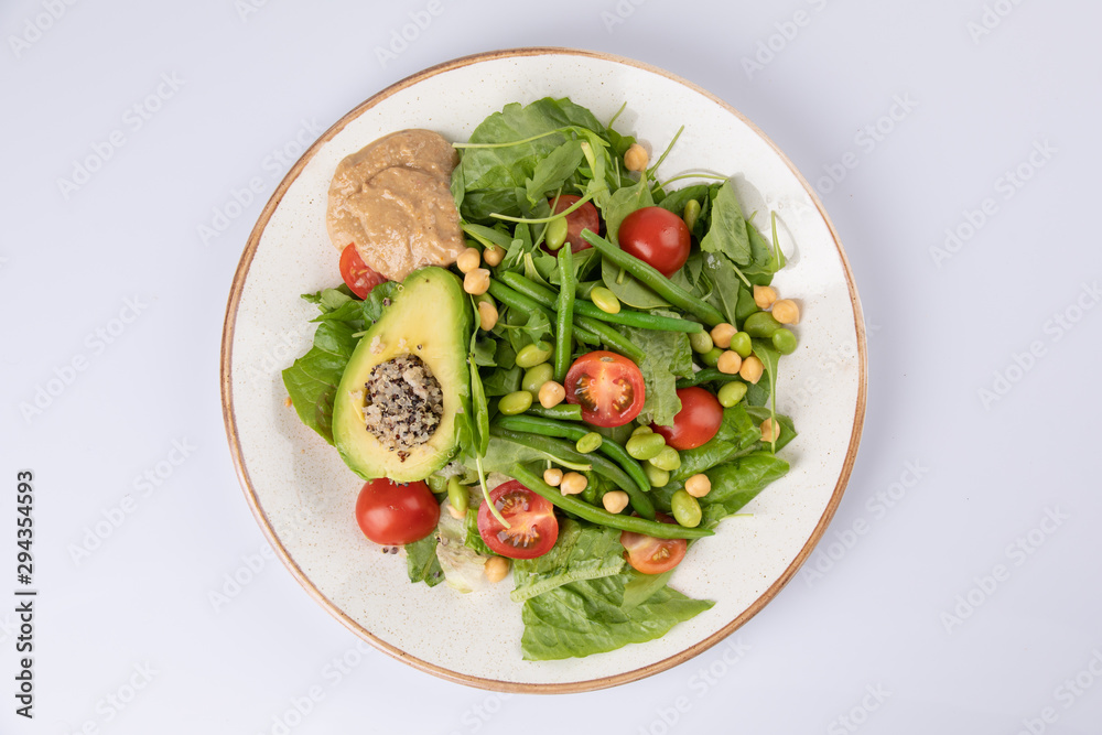 Healthy natural food. Salad with green vegetables, vitamins on the plate.