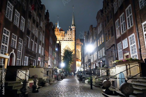 Fototapeta Naklejka Na Ścianę i Meble -  Gdansk, Poland - September 2019: View of the night streets of the city. The architecture of the old city in the night.