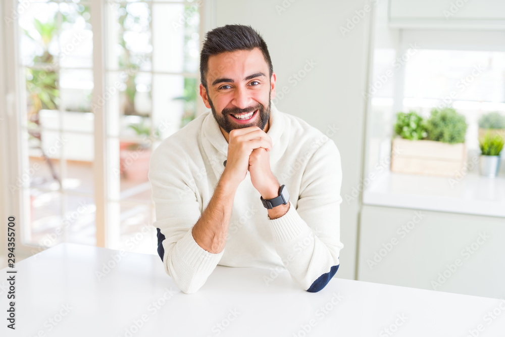 Handsome man smiling cheerful with a big smile on face showing teeth, positive and happy expression Handsome man smiling cheerful with a big smile on face showing teeth, positive and happy expression
