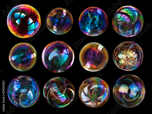 Group of soap bubbles isolated on black background. photo