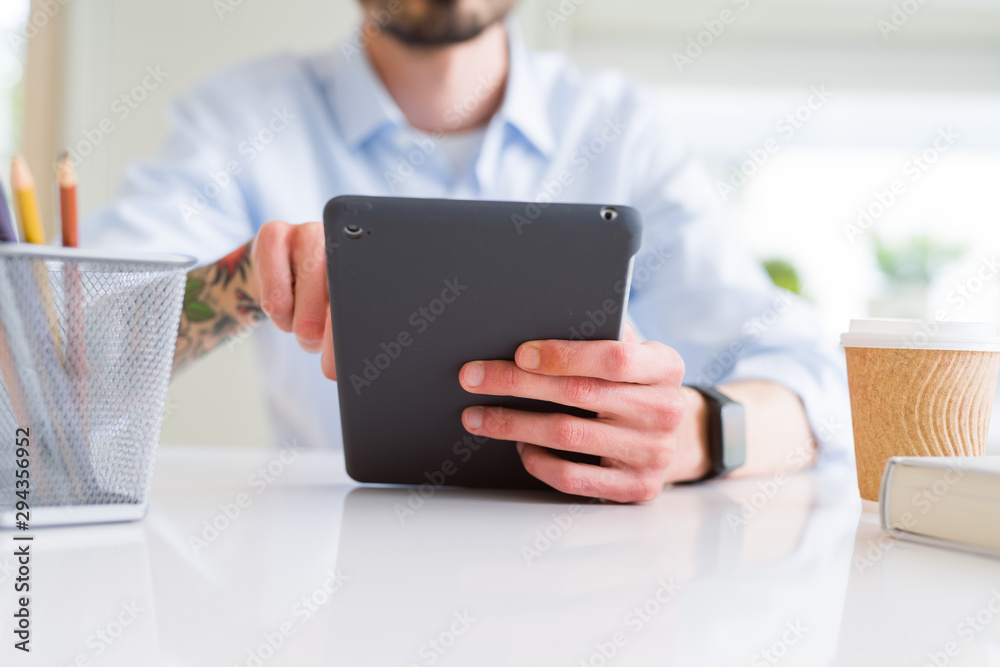 Close up of business man working using touchpad tablet